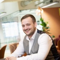 Man in a white shirt and grey waistcoat