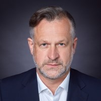 Guy Barnes, businessman in a white shirt and blue suit