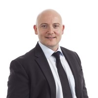 Businessman with a white shirt, black tie and black suit jacket