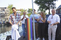 Reveal of the first 'Power to the Heroes' electric vehicle charging station in Amsterdam this morning. Left to right: initiators Job Karstens (EVBox), Ronald Stahli (Nuon), Mathieu Wijnen (Amsterdam), Linda Roskam (Amsterdam) and Vincent Jongejans (Nuon).