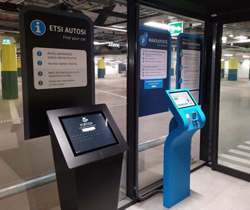 Two screens in the parking garage where you can insert your licence plate number