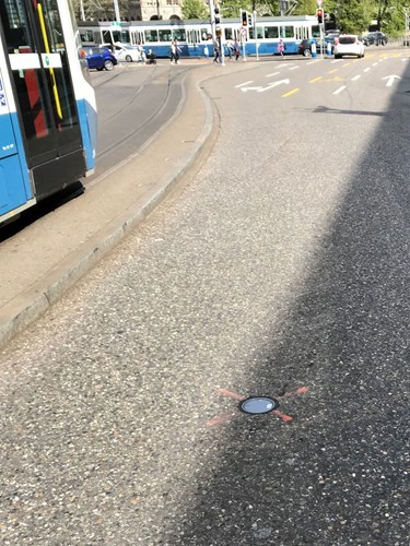 TAPS sensor on the road, tram and other traffic in the background