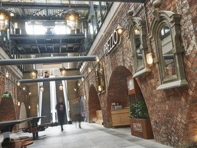 Interior of Market Place shopping center in Bolton, elevators in background