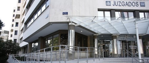 Exterior of a multistory office building, showing steps up to the entrance