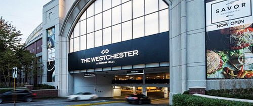 Exterior of the car park at Westchester Shopping Mall, vehicles enter and exit