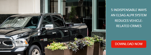 Black pick-up truck parked by the building