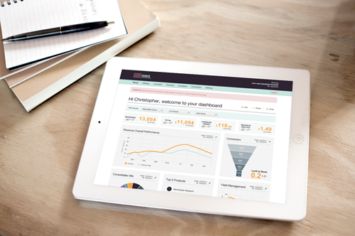 Notebook with a pen and tablet displaying an internet page filled with graphs lie on a table.